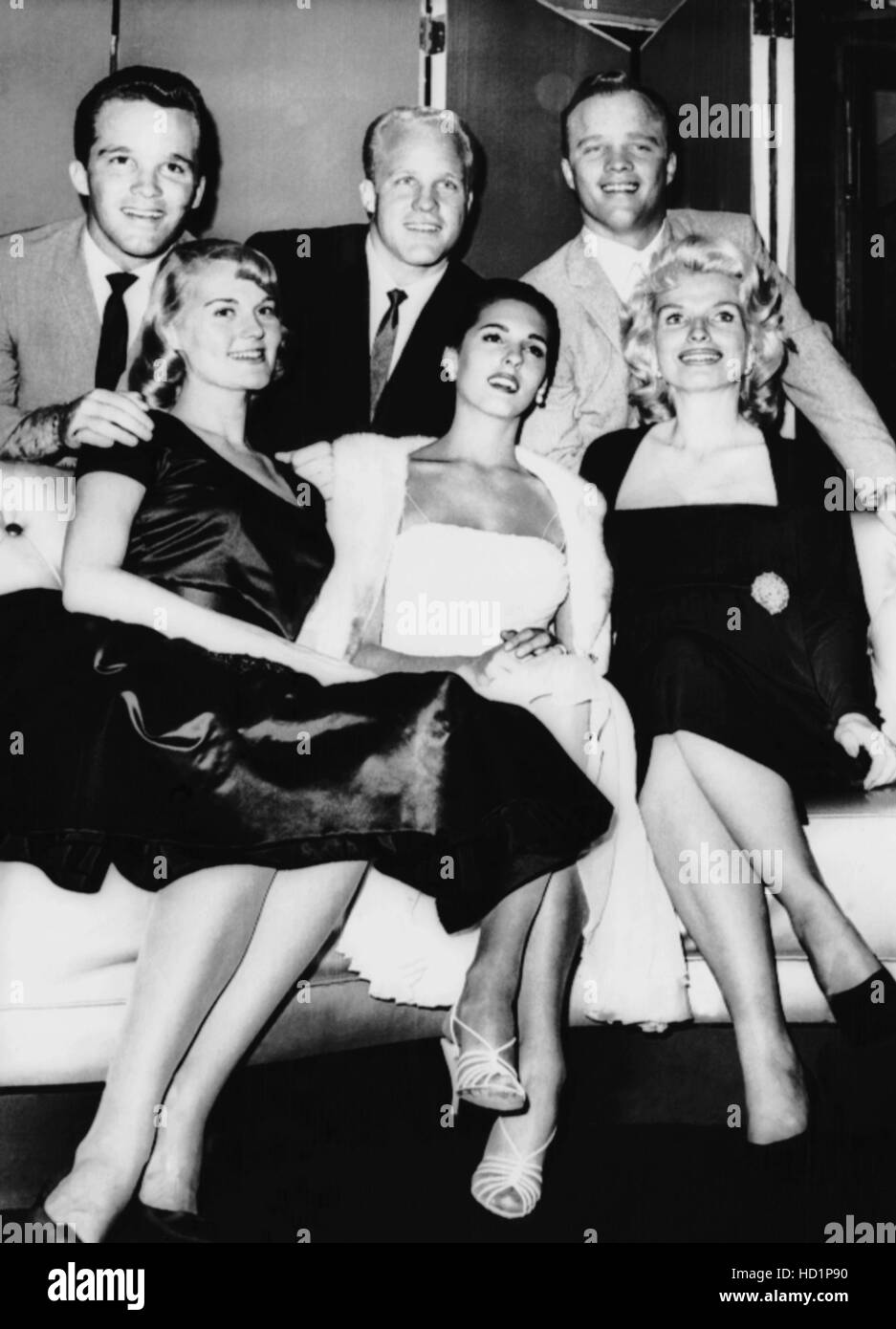 Three of Bing Crosby's sons and their wives, September 1960. Top, from  left: Lindsay Crosby, Phillip Crosby, Dennis Crosby Stock Photo - Alamy