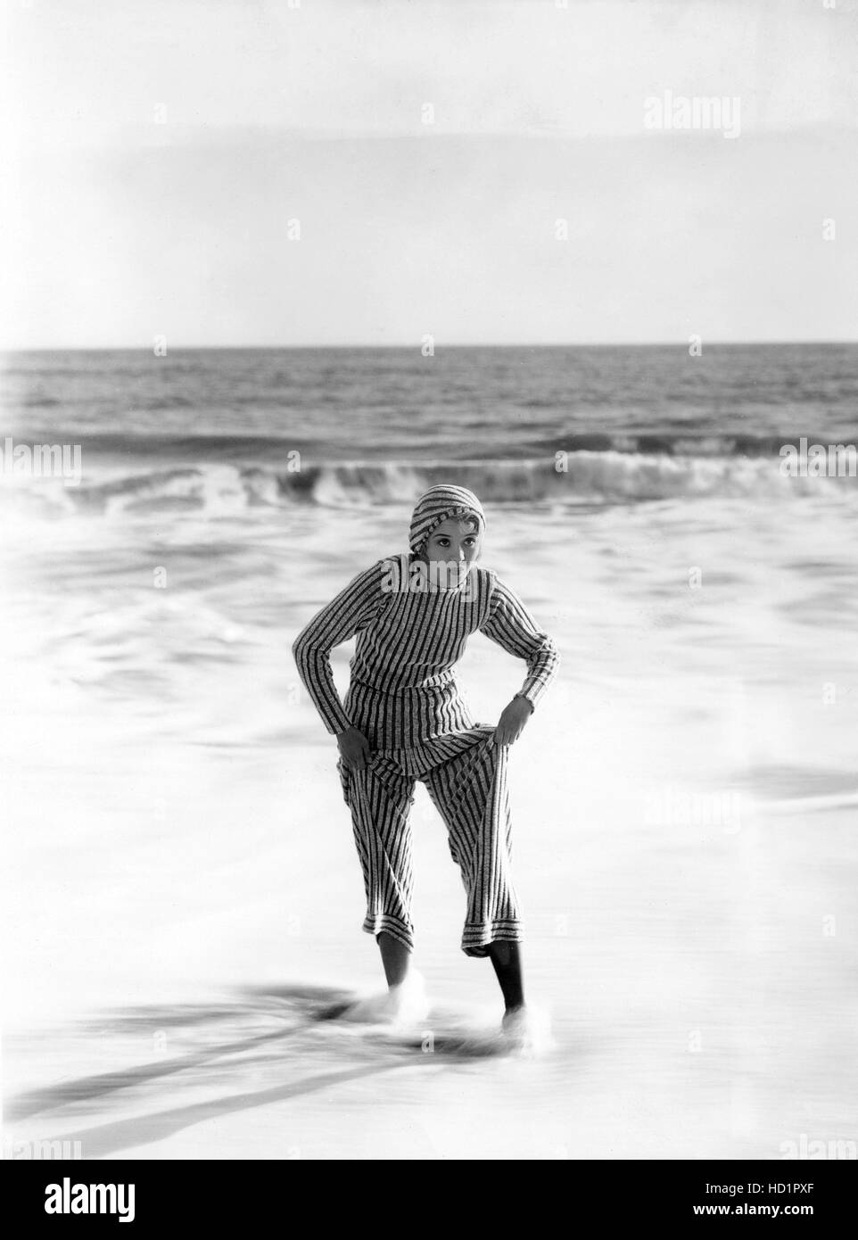 Marian Marsh, wearing an 'orange and white striped pajama-towelling beach costume', Warner Brothers, 1931 Stock Photo