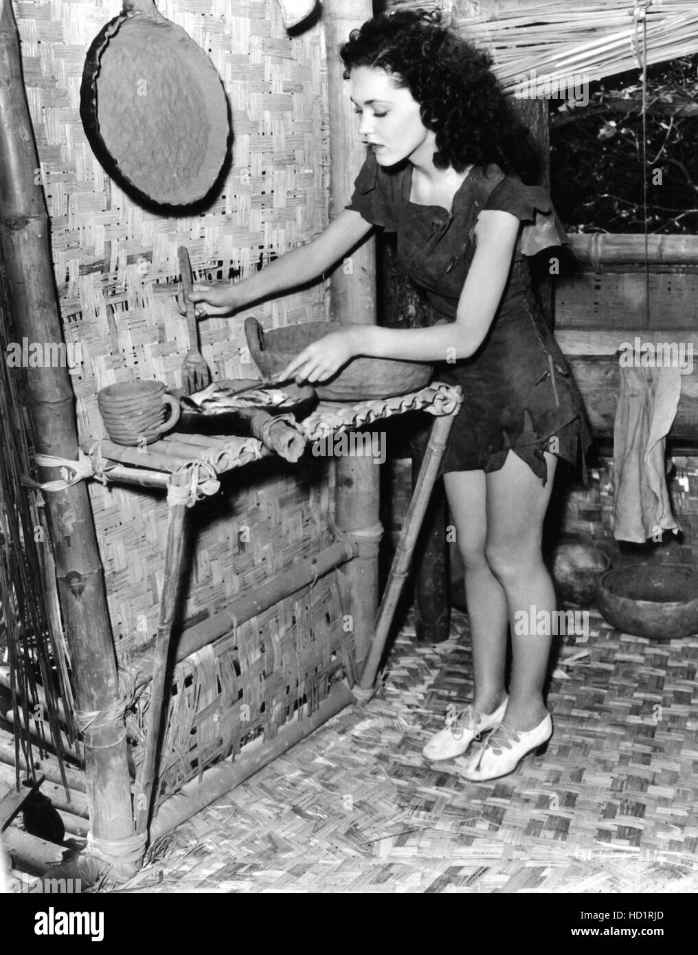 Maureen O'Sullivan, making breakfast for Tarzan, ca. 1940 Stock Photo ...