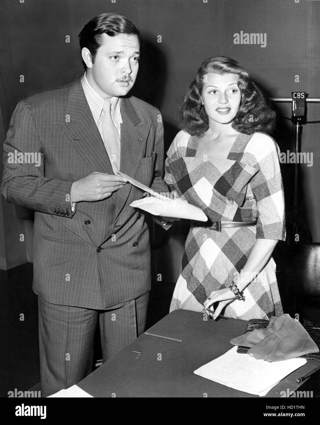 Orson Welles and wife Rita Hayworth read through the THERE ARE FRENCHMEN AND FRENCHMEN for Welles' C.B.S. radio program, Stock Photo