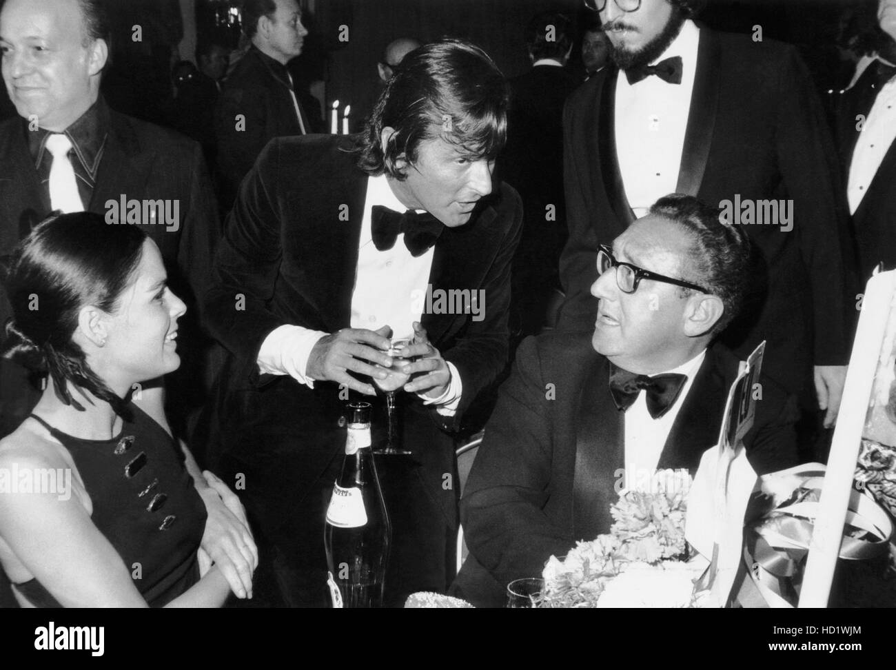 From left, Ali MacGraw, Robert Evans, Henry Kissinger, at the premiere party for THE GODFATHER, St. Regis Hotel, March 14, 1972 Stock Photo