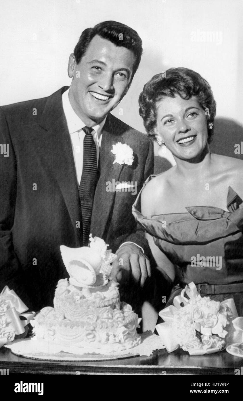 ROCK HUDSON and bride PHYLLIS GATES cut the wedding cake after eloping ...