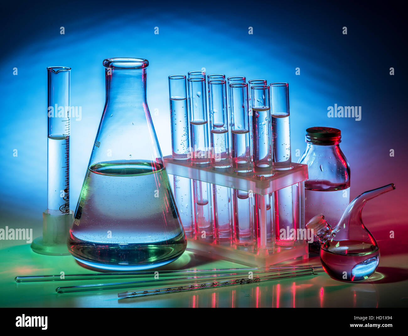 Different laboratory beakers and glassware. Multicolored Stock Photo
