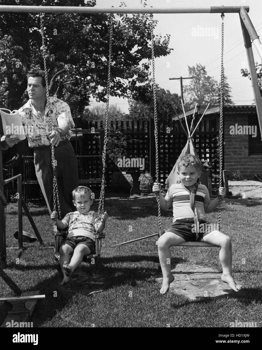 Riobert Ryan, with his sons, from left, Tim Ryan, heyney Ryan, ca. 1953