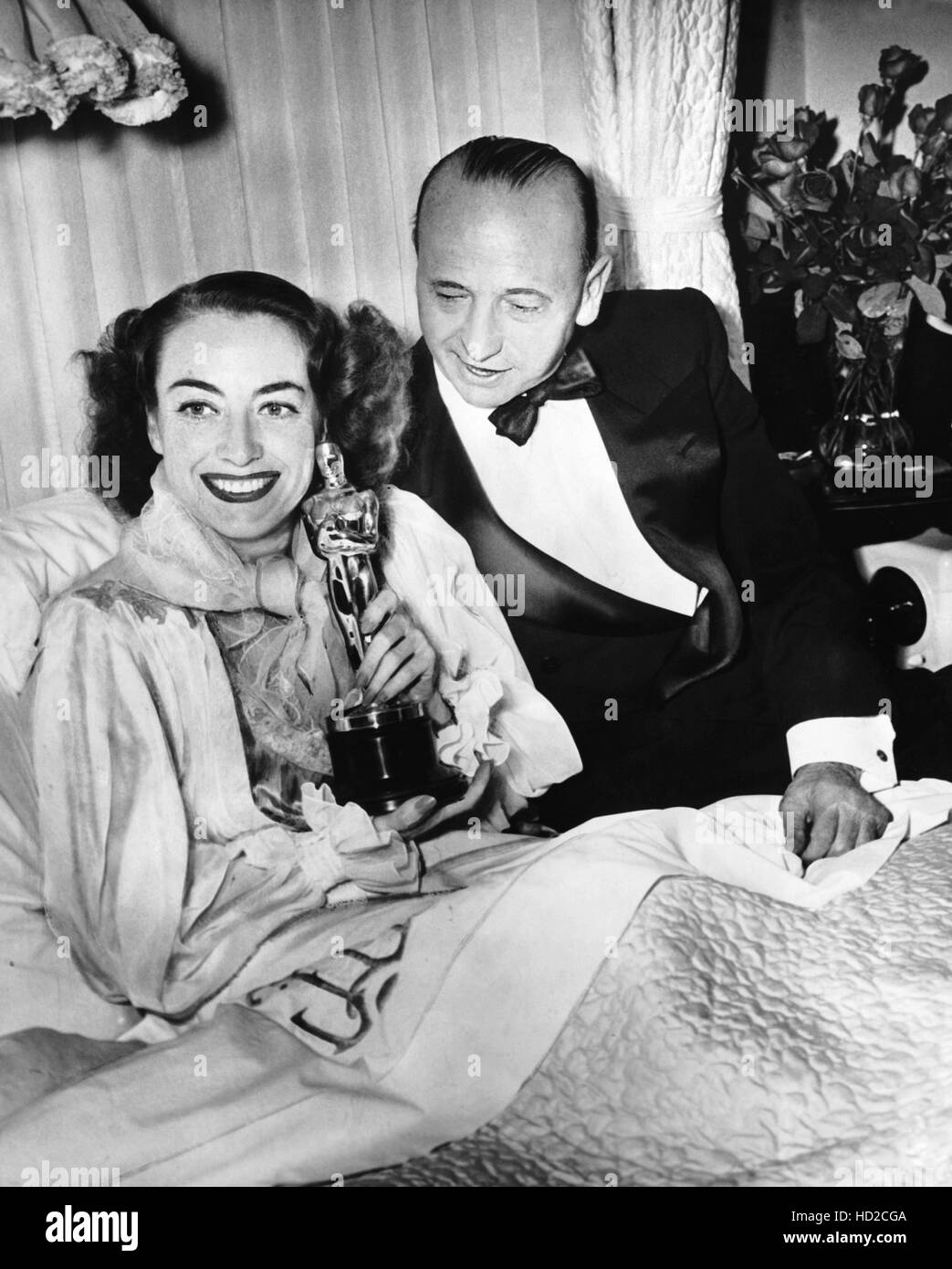 Joan Crawford left in bed with her MILDRED PIERCE Oscar and director Joan Crawford left in bed with her MILDRED PIERCE Oscar and director
