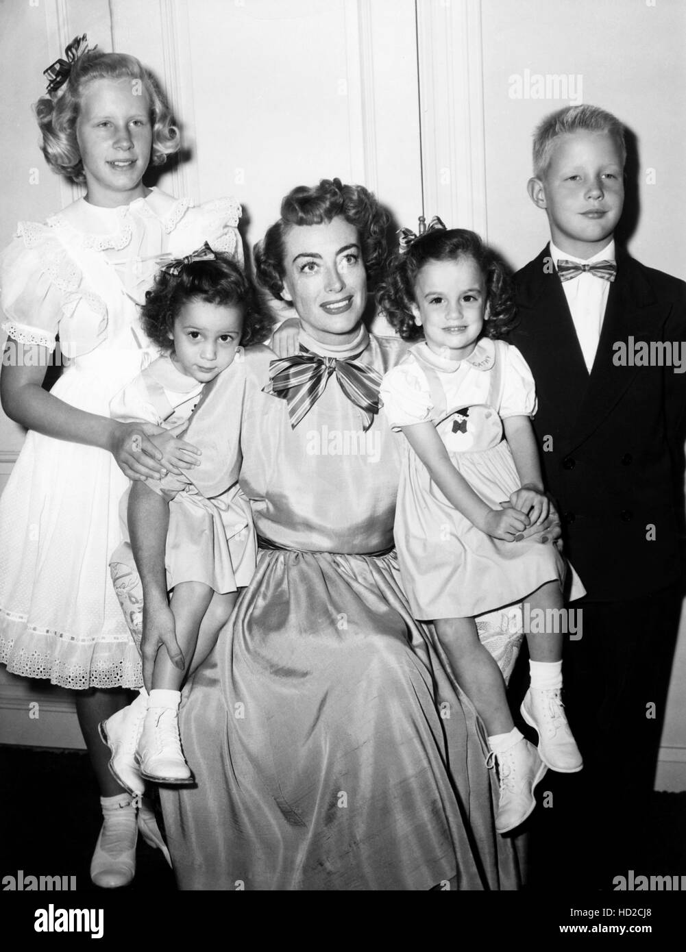 Joan Crawford, with her children, from left, Christina Crawford, Cathy