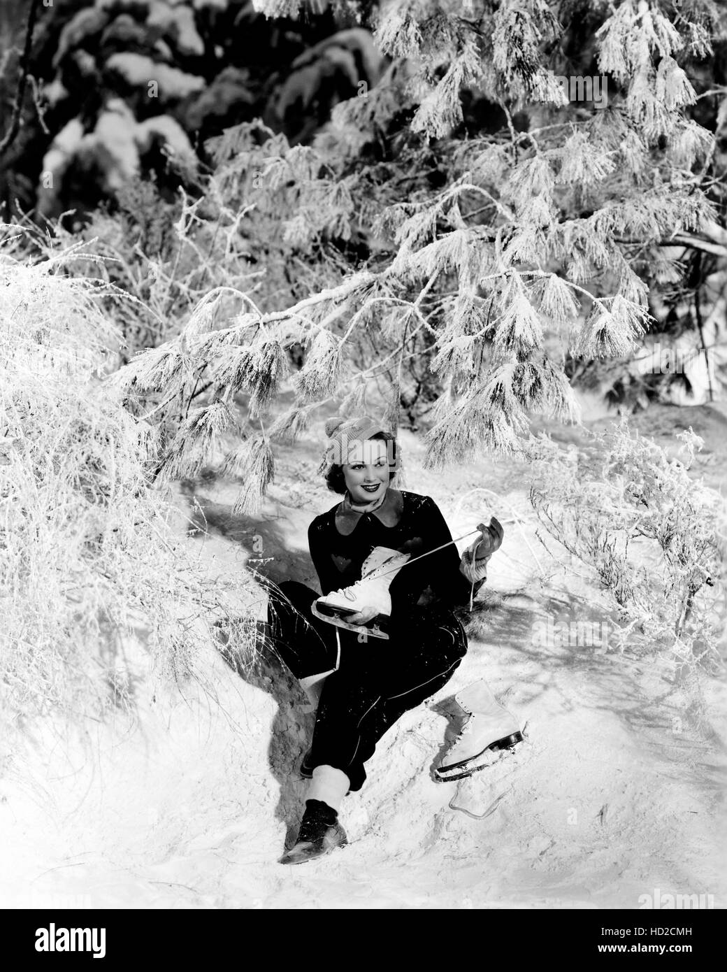 June Lang wears a navy wool ski suit with powder blue flannel trim