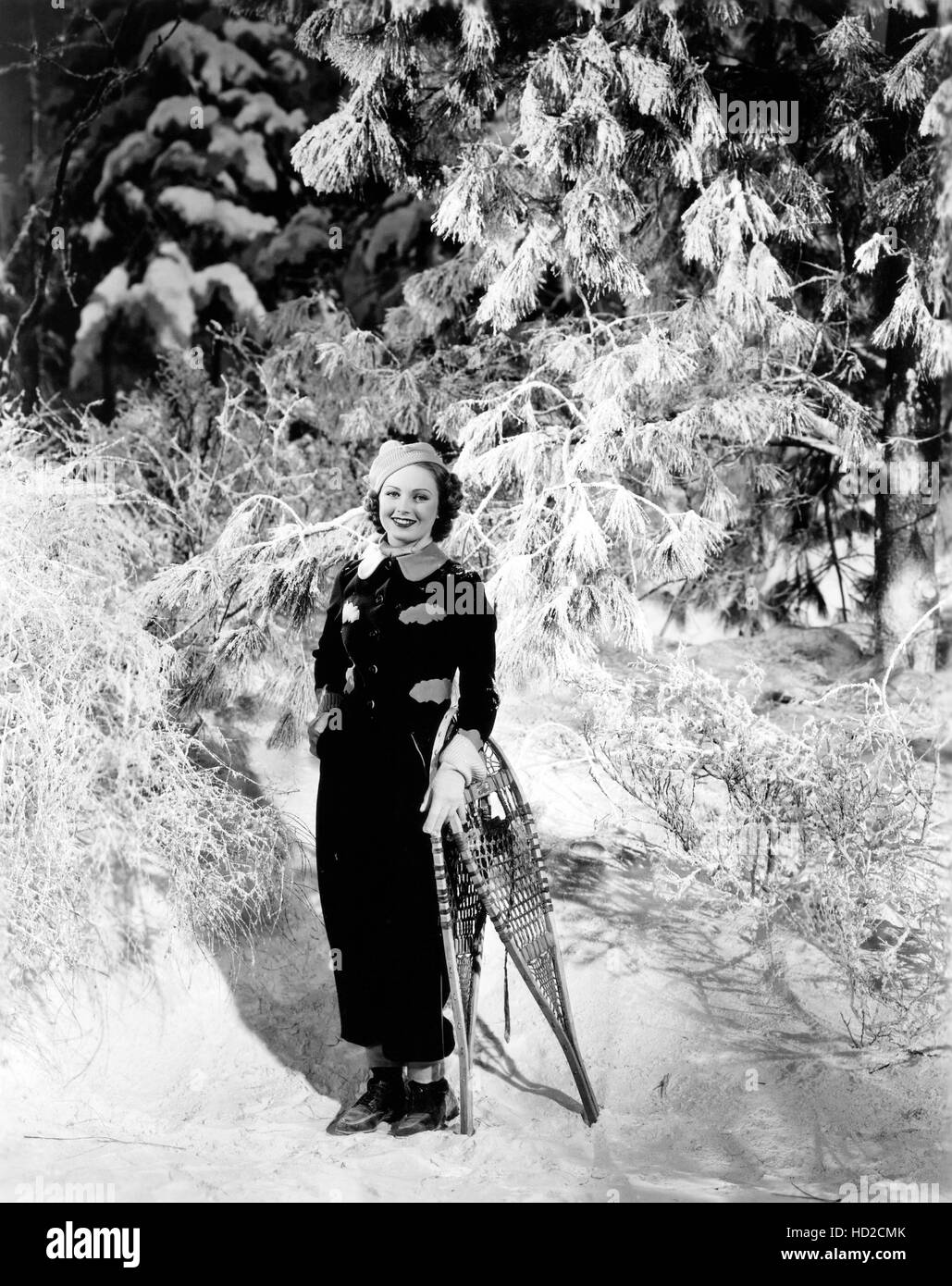 June Lang wears a navy wool ski suit with powder blue flannel trim