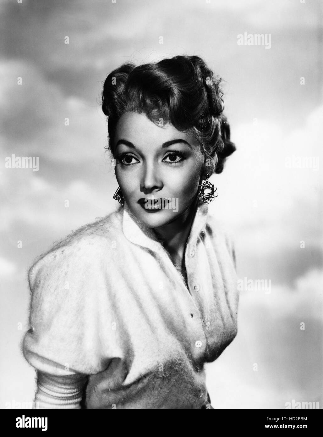 Mari Blanchard, wearing 'atom earrings,' 1955 Stock Photo