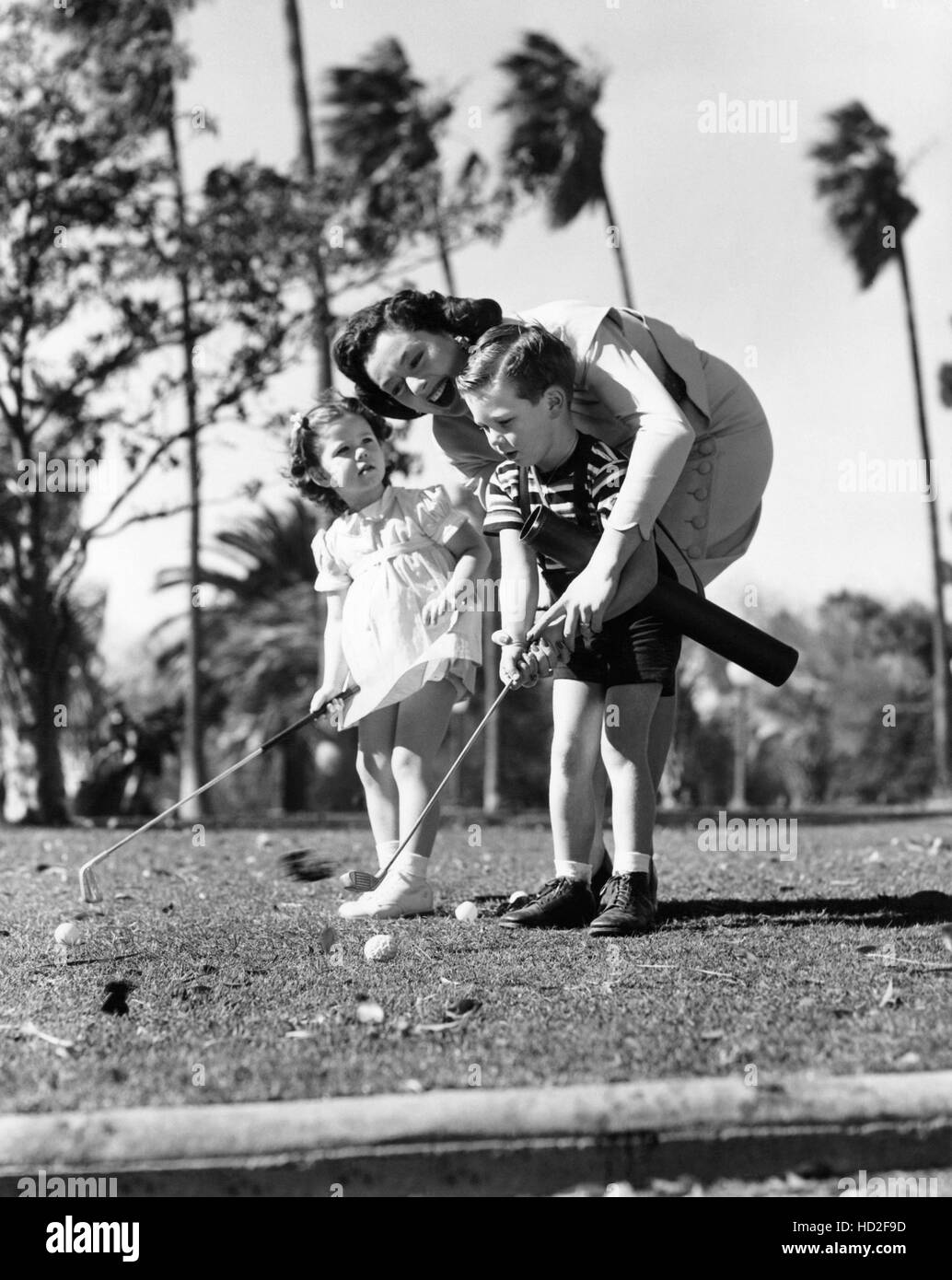 Rosalind Russell (center) teaching her son, Lance Brisson and George ...
