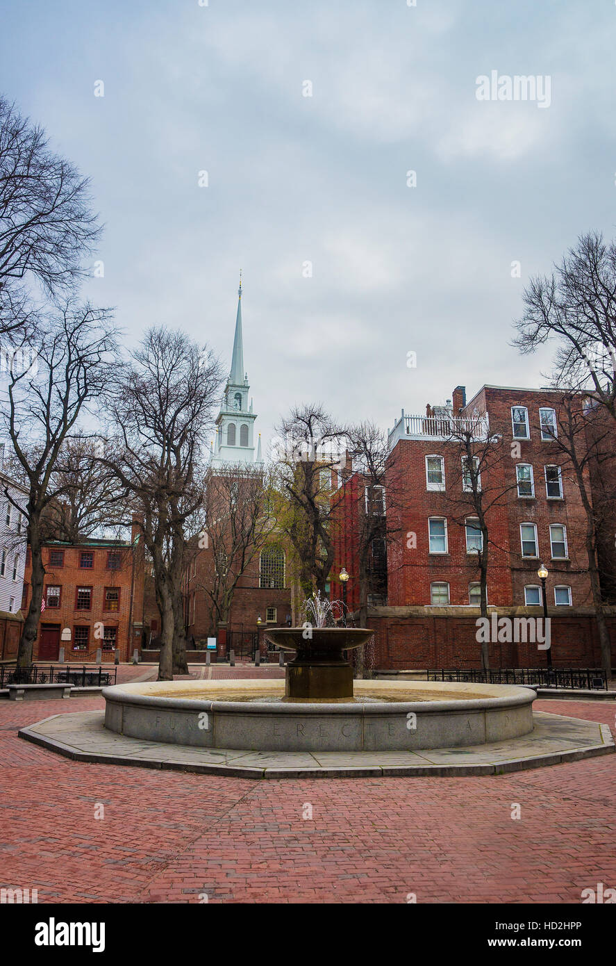 Boston, USA - April 28, 2015: Old North Church and fountain at downtown Boston, Massachusetts, the United States. People on the background Stock Photo