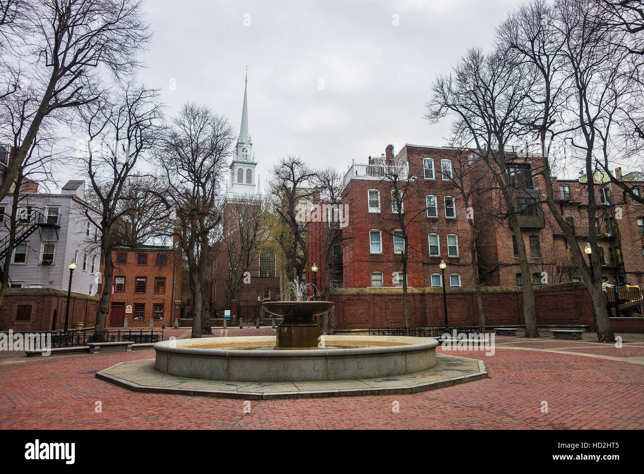 Boston, USA - April 28, 2015: Old North Church and fountain in downtown Boston, Massachusetts, the United States. People on the background Stock Photo