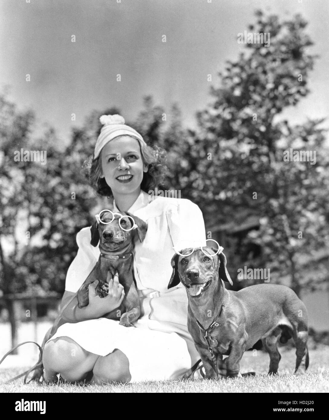 Phyllis Welch shown with a pair of Dachshunds given to her by actor ...