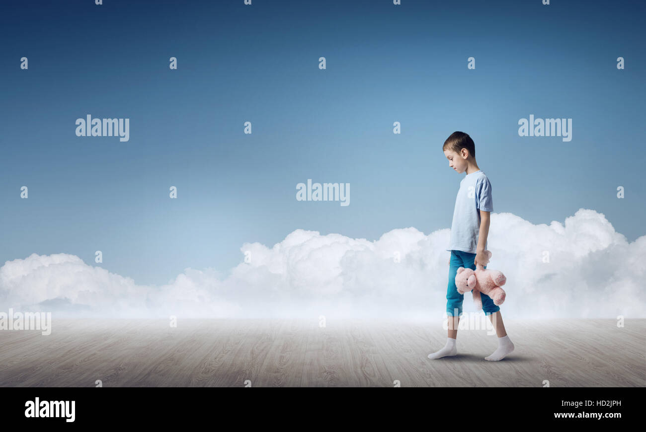 Boy with bear toy Stock Photo - Alamy