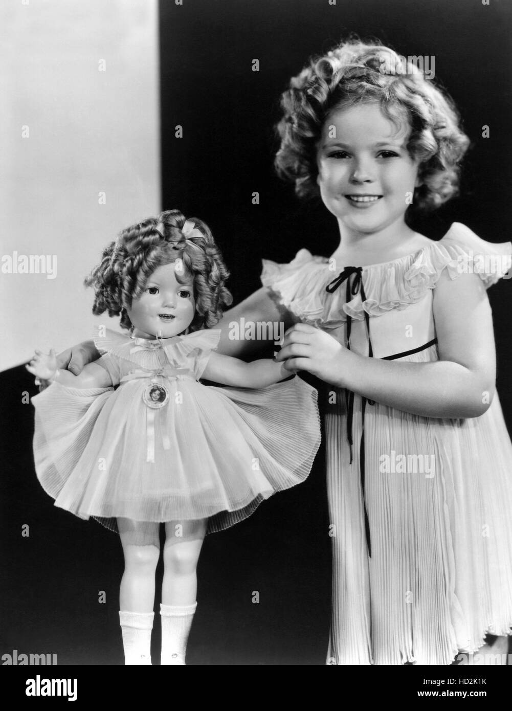 Shirley Temple with a Shirley Temple doll, ca. 1935-1936 Stock Photo