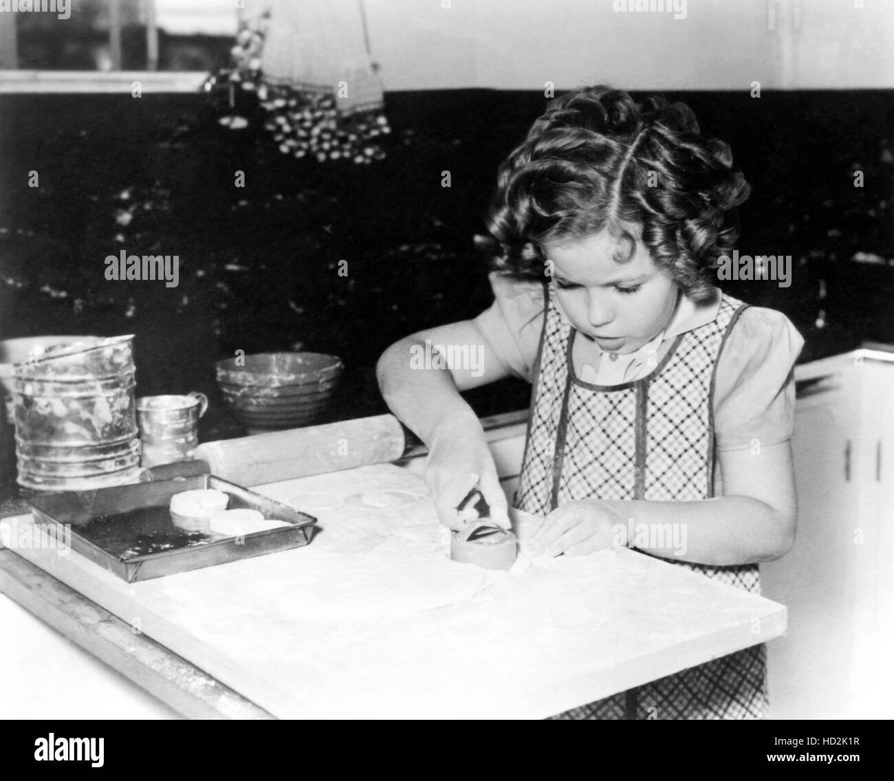 Shirley Temple baking cookies, ca. 19341935 Stock Photo Alamy