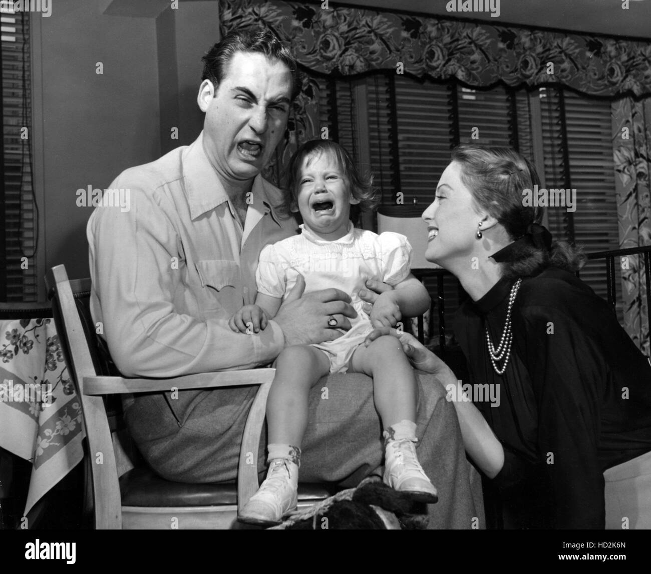 Sid Caesar, daughter Michele, wife Florence in their Forest Hills home, New York, April 10, 1949. Stock Photo