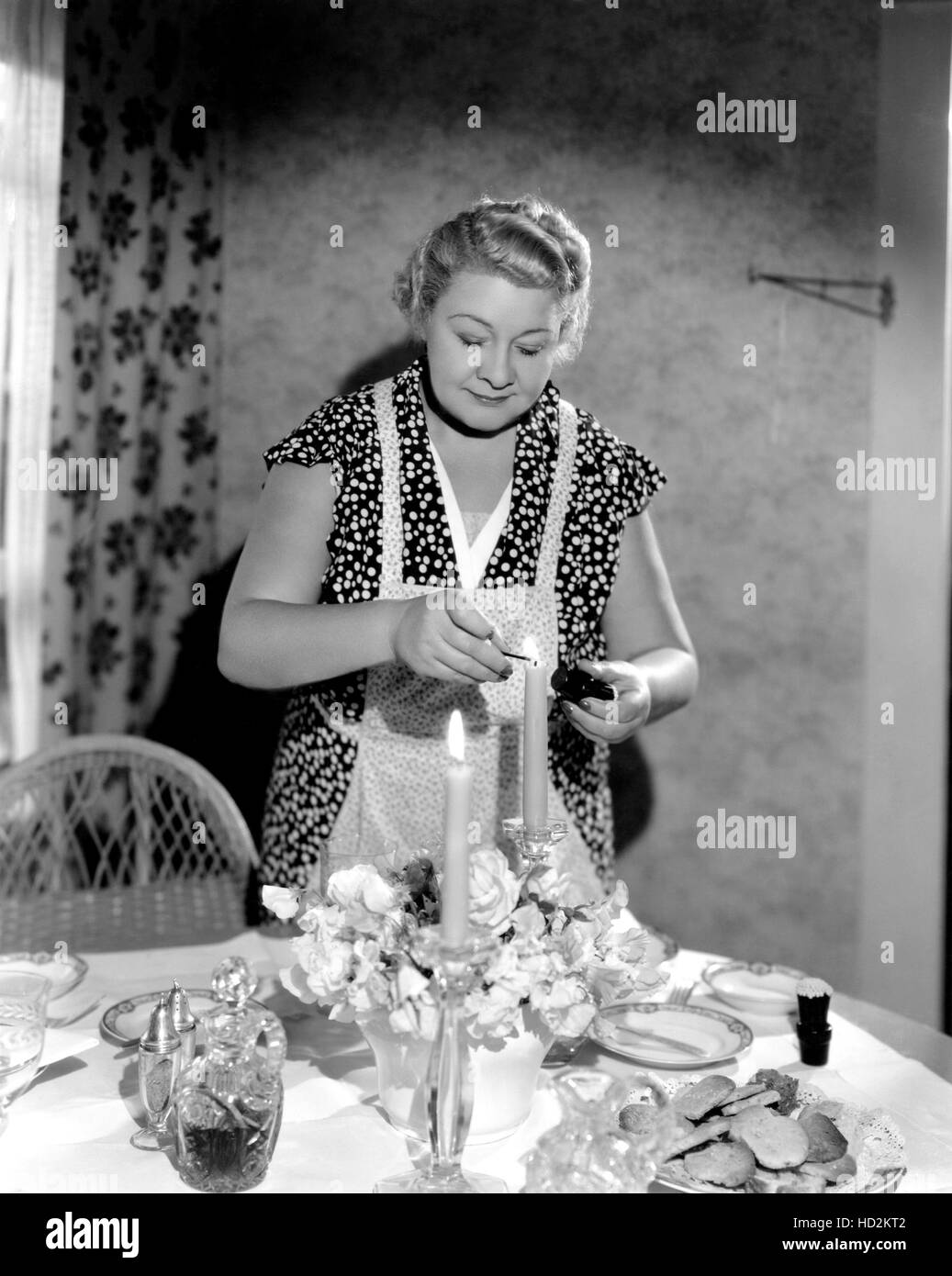 Sophie Tucker lighting dinner candles at her home, Hollywood ...