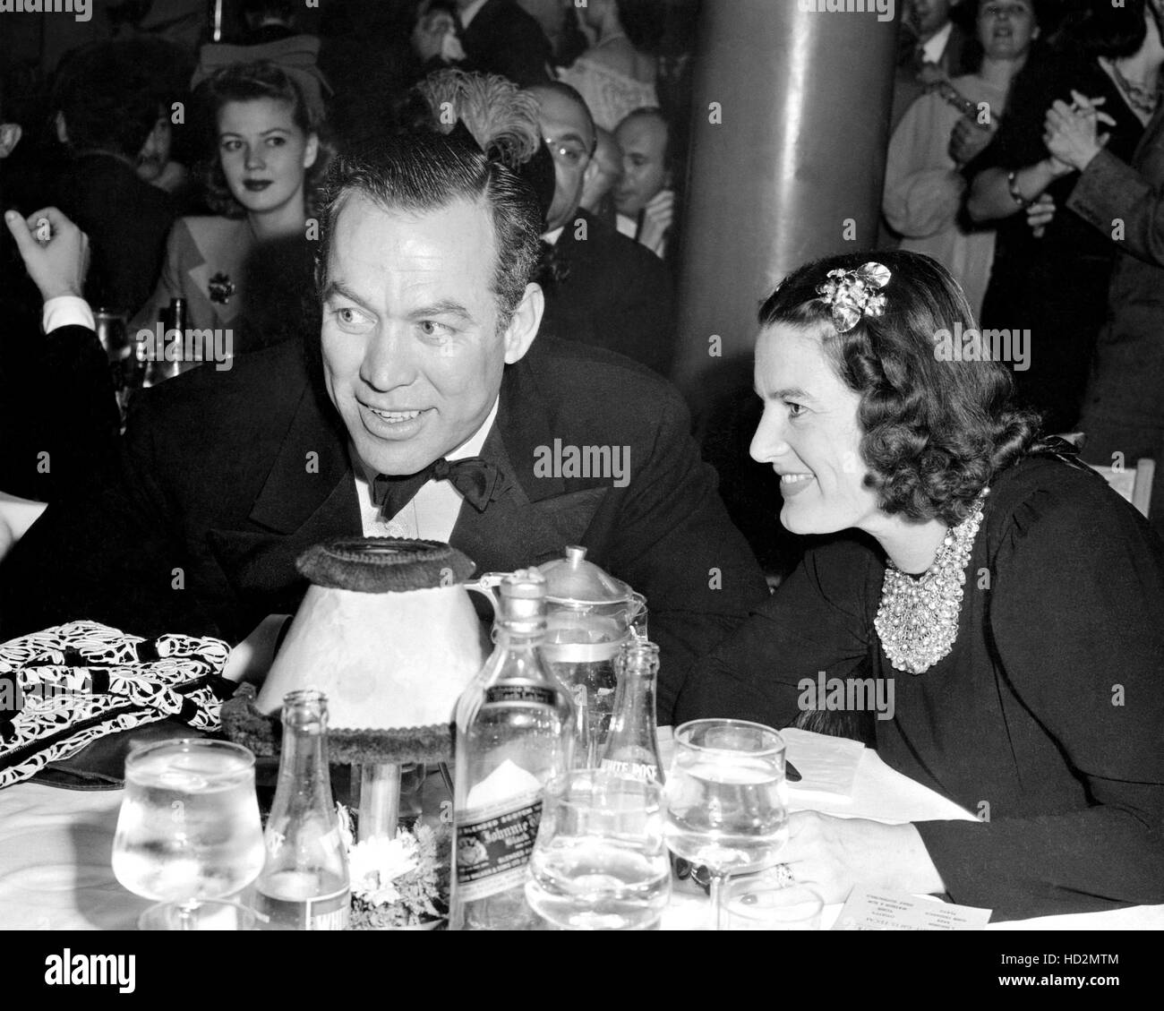From left Ward Bond with wife, Doris, at Mocambo, ca. 1942 Stock Photo