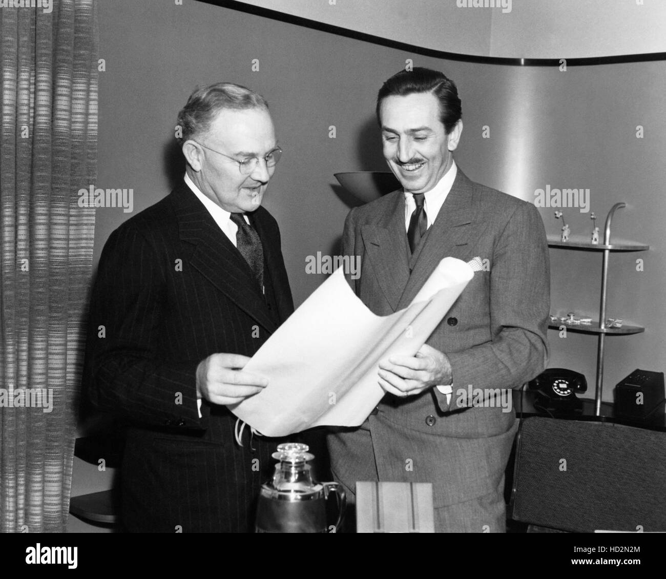 From left Los Angeles mayor Fletcher T. Bowron handing Walt Disney the
