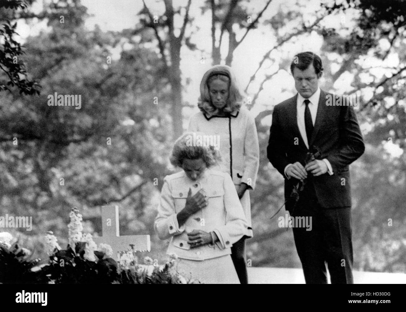 Front to back: Ethel Kennedy prays at the grave of her husband, the