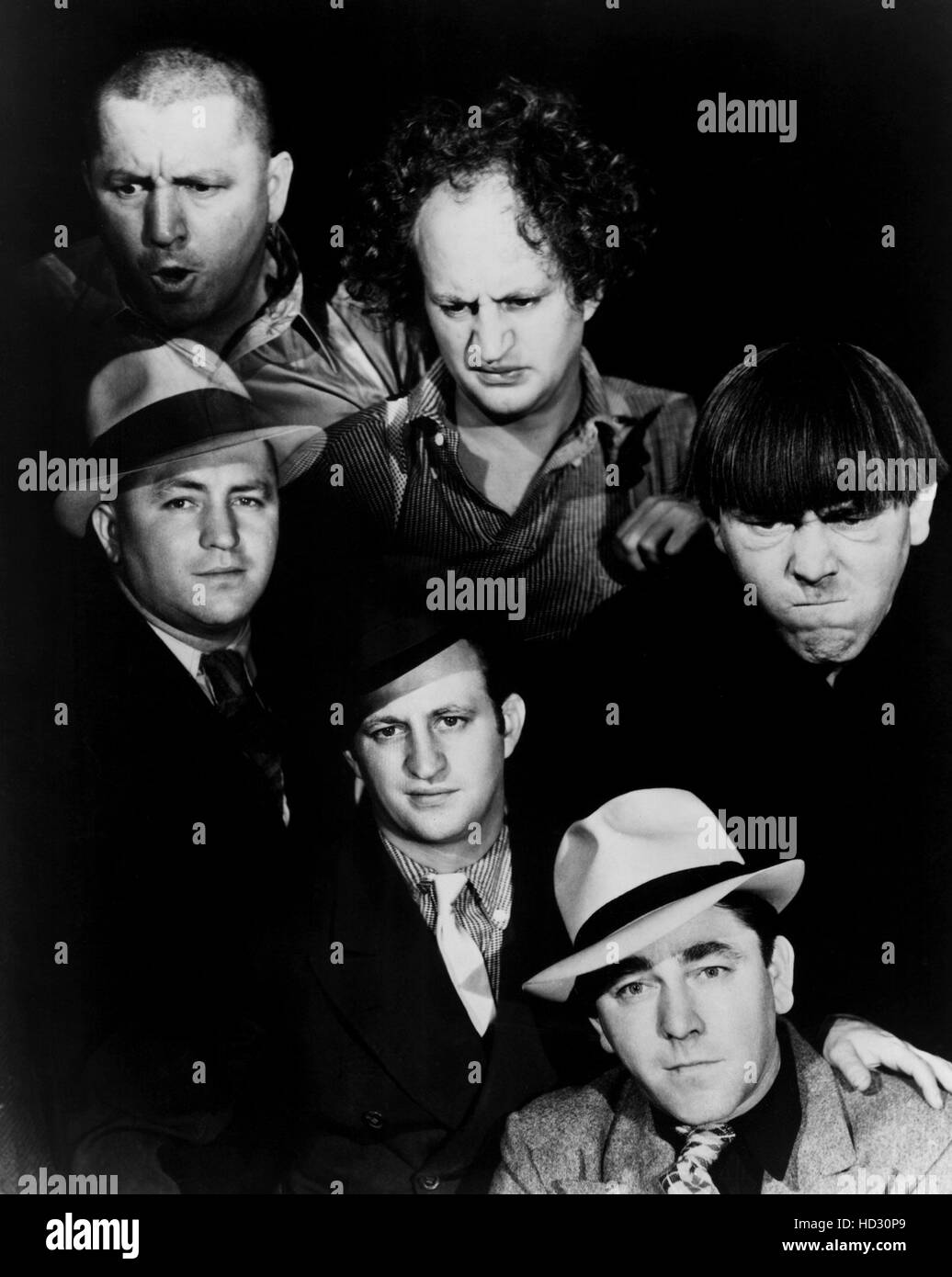 THE THREE STOOGES and their alter egos: CURLY HOWARD, LARRY FINE, MOE HOWARD; Columbia publicity shot, 1930s Stock Photo