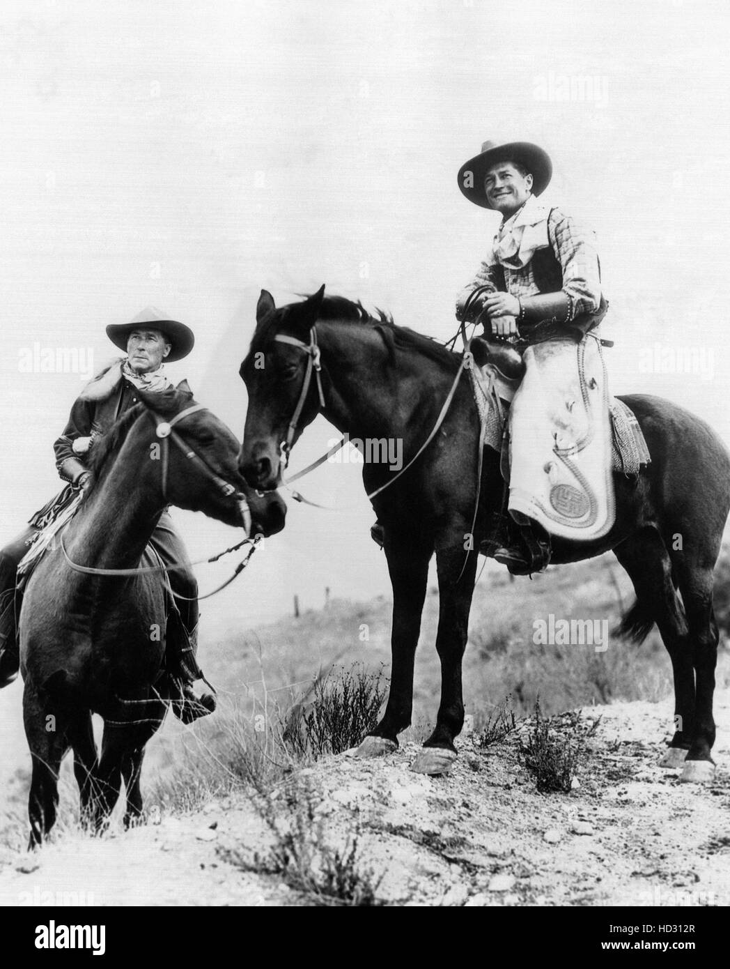 William S. Hart, left, introduces Hollywood Maurice Chevalier