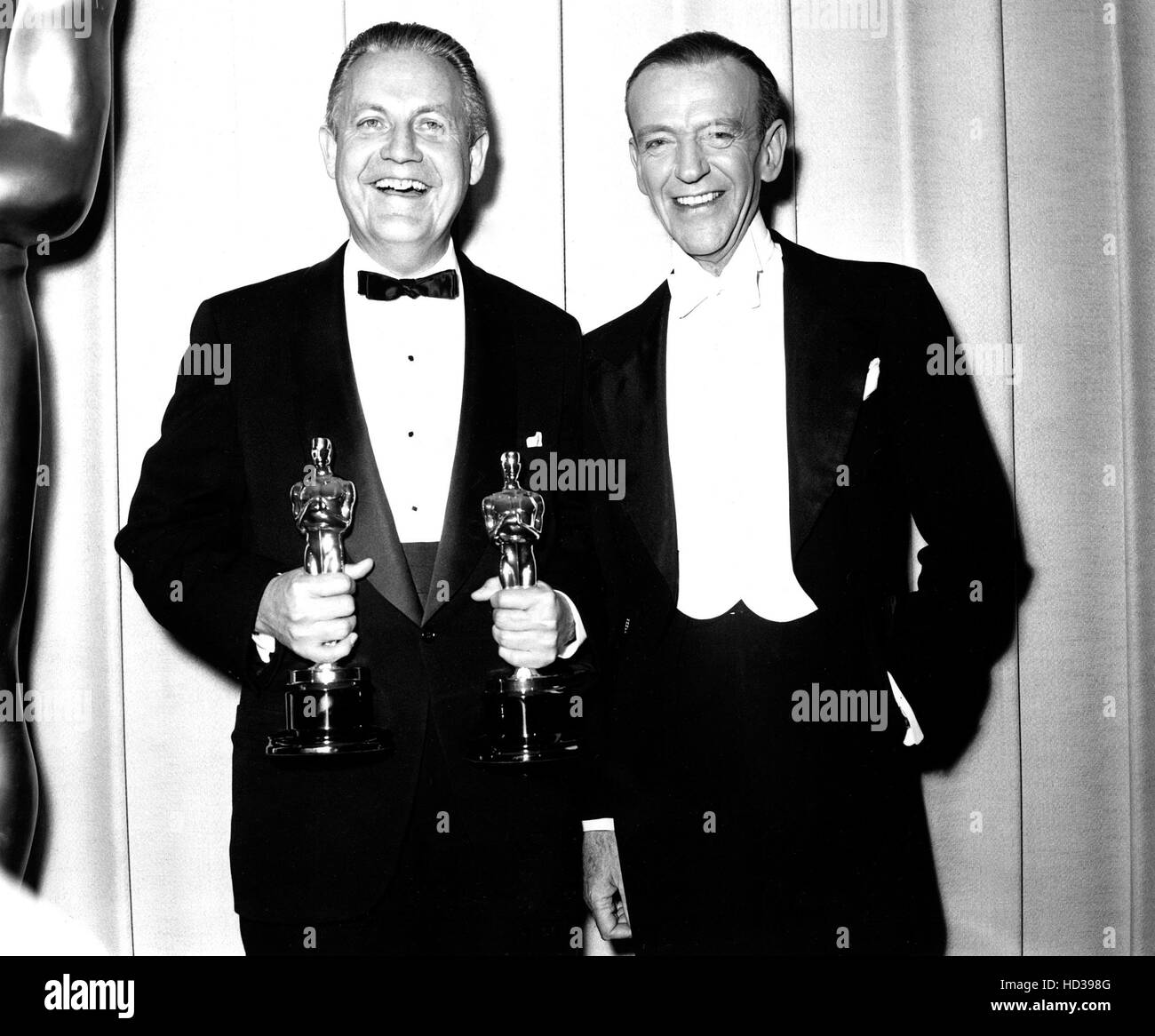 Robert Wise holding his producer and director Academy Awards for WEST ...