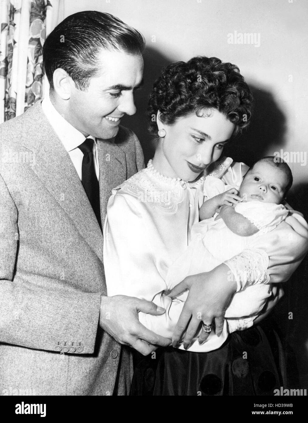 TYRONE POWER and wife LINDA CHRISTIAN proudly pose with their newborn ...