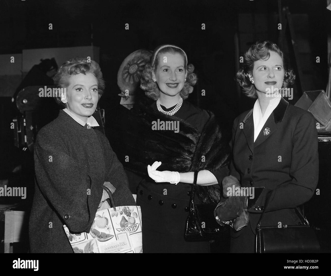 Actress Deborah Kerr entertains visitors on the set of THE END OF THE