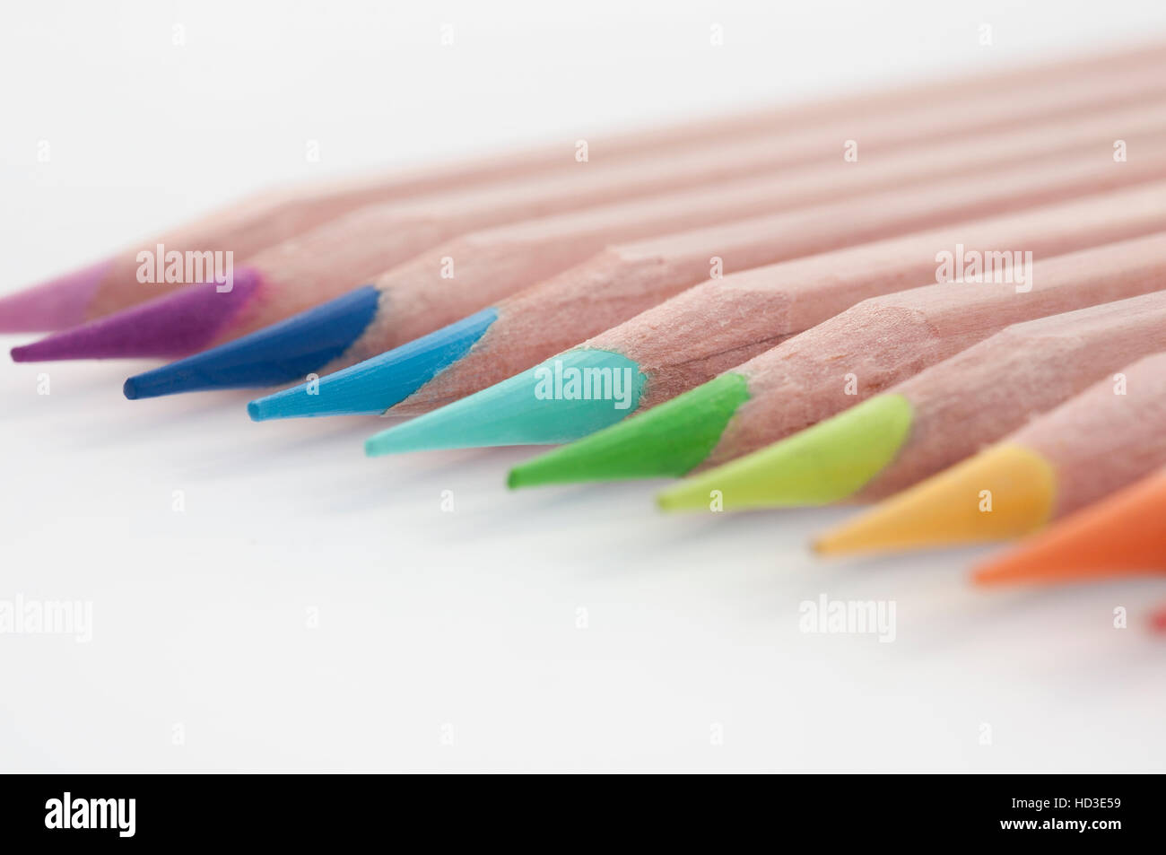 Colouring pencils lined up together, focused on blue pencils Stock Photo