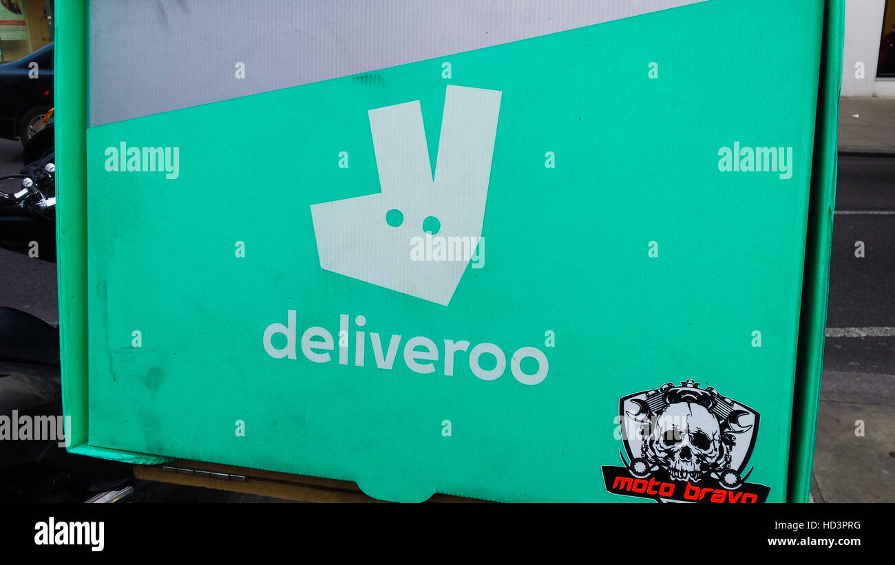 Deliveroo Online food ordering company delivery bike box in London