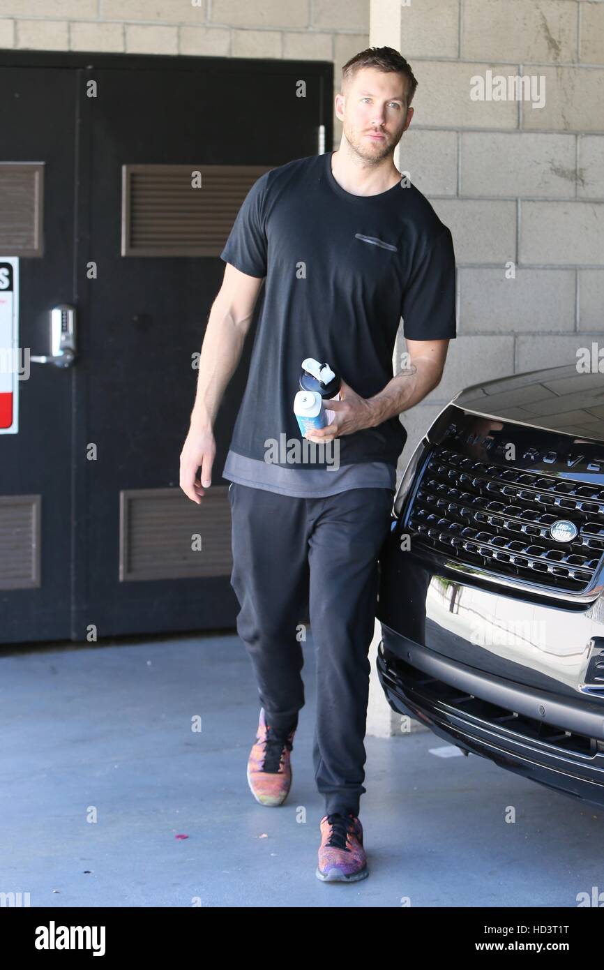 Calvin Harris post-workout carries an empty protein shake bottle and juice  container as he makes his way to the car Featuring: Calvin Harris Where:  Los Angeles, California, United States When: 01 Sep