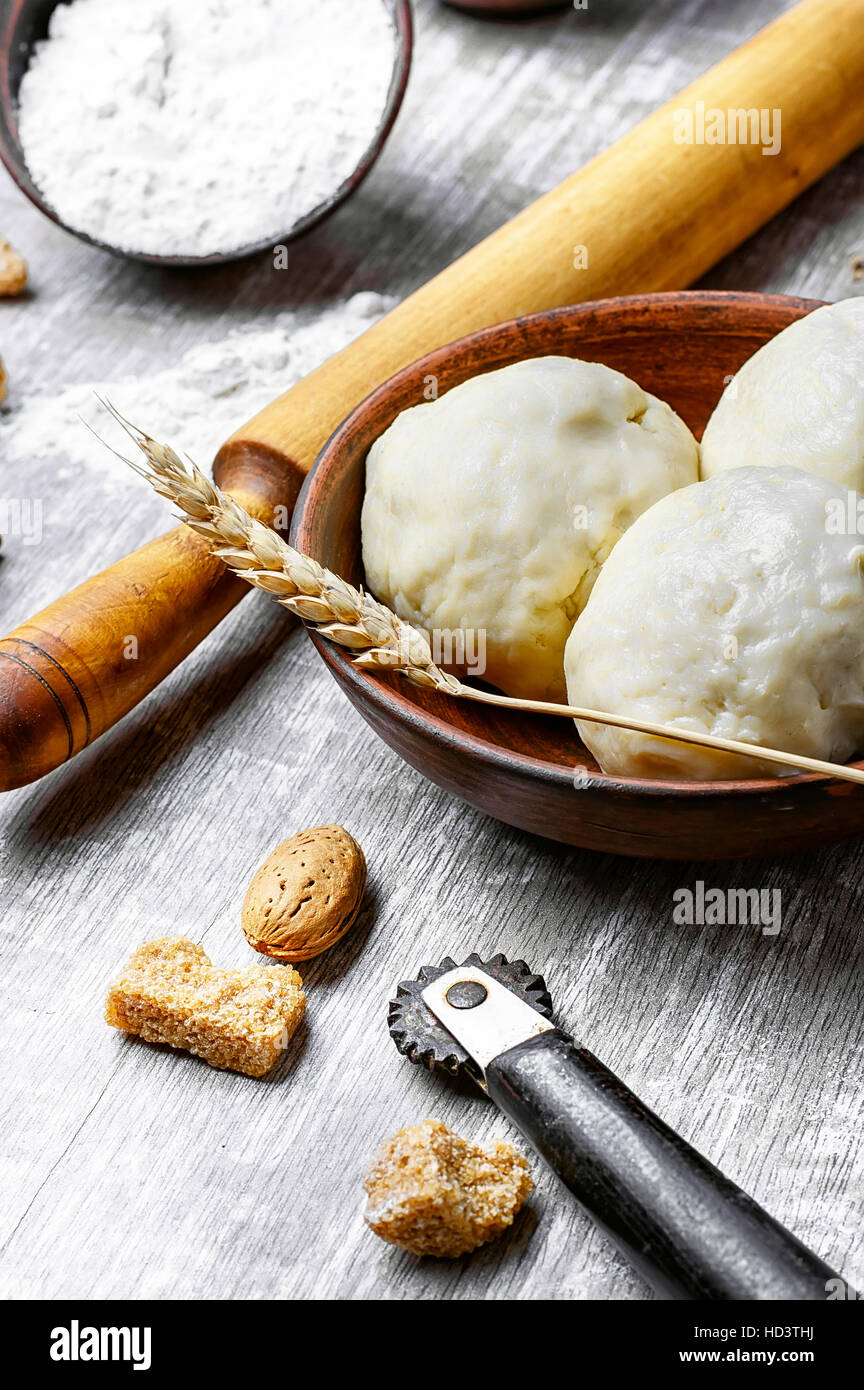 preparing bread dough and baking ingredients on light background Stock