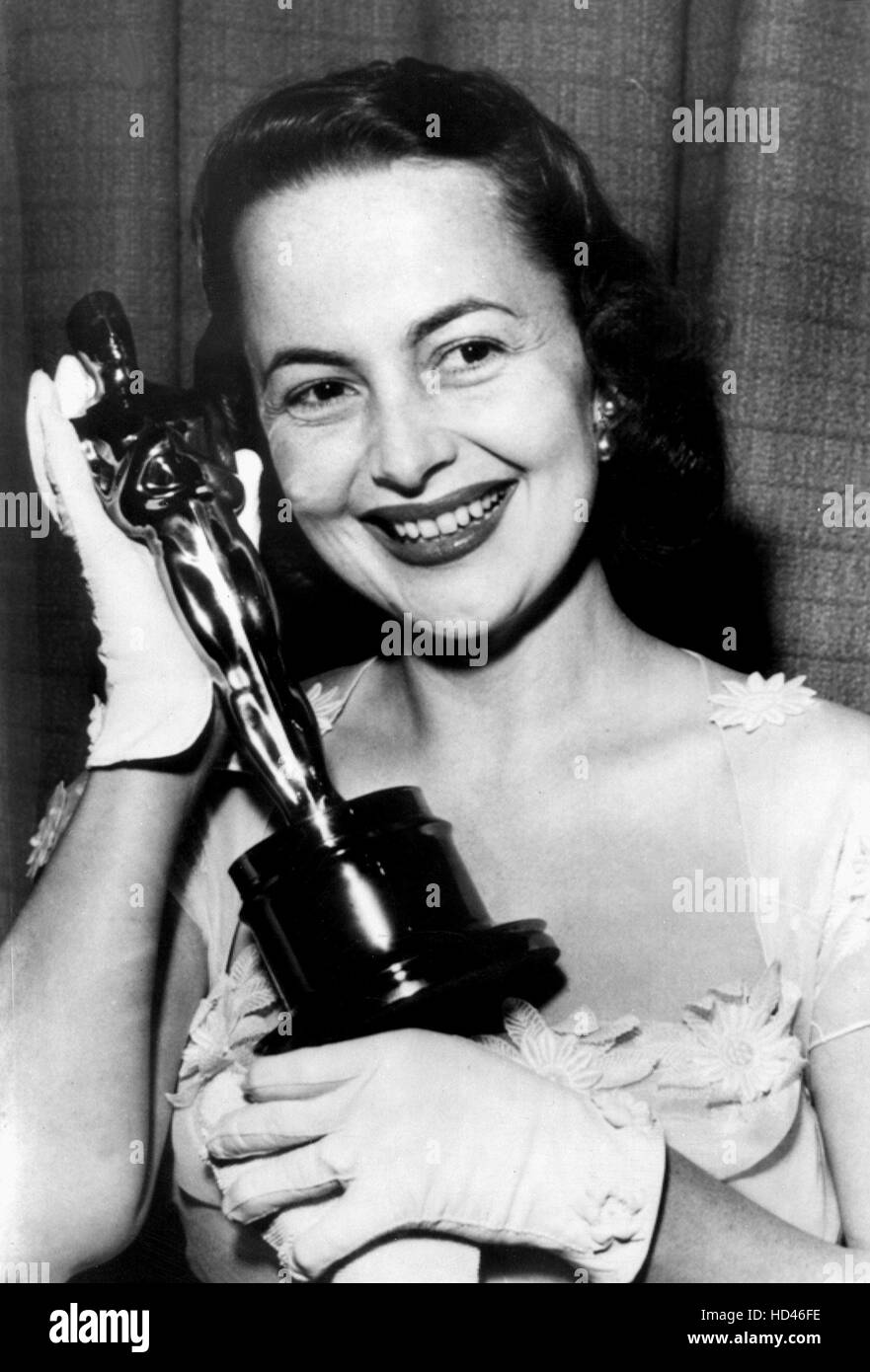 1949: OLIVIA DE HAVILLAND [Best Actress, THE HEIRESS] happily holds up ...