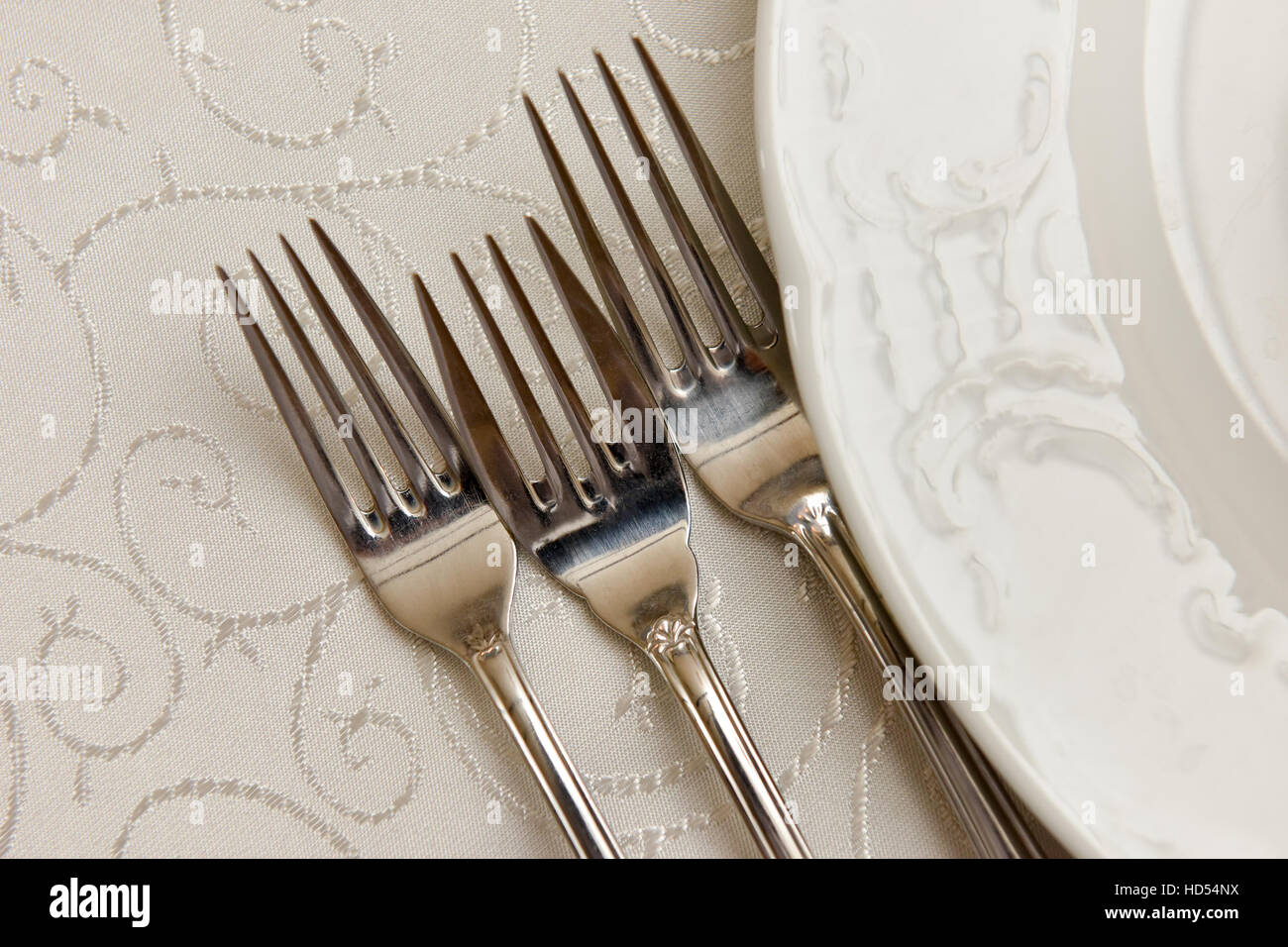 Cutlery and plate on the table in natural light Stock Photo