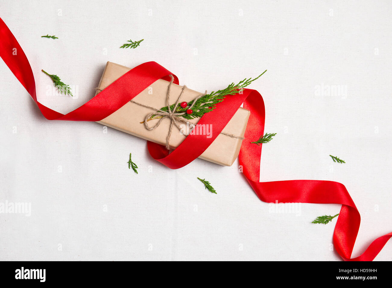 Christmas presents. Hand crafted xmas gift on table. Stock Photo