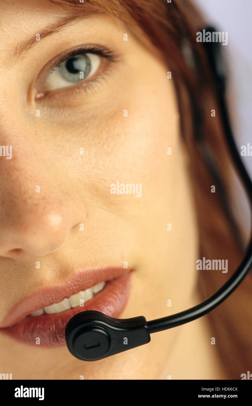 Woman with a handsfree telephone headset Stock Photo Alamy