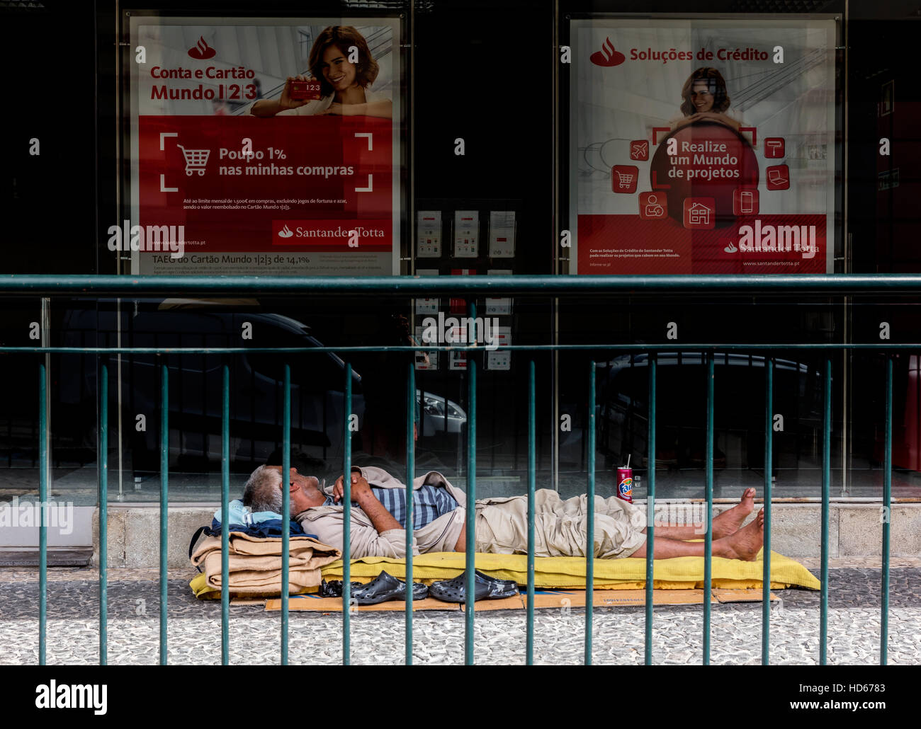 Homeless sleeping at bank branch, Funchal, Madeira, Portugal Stock Photo