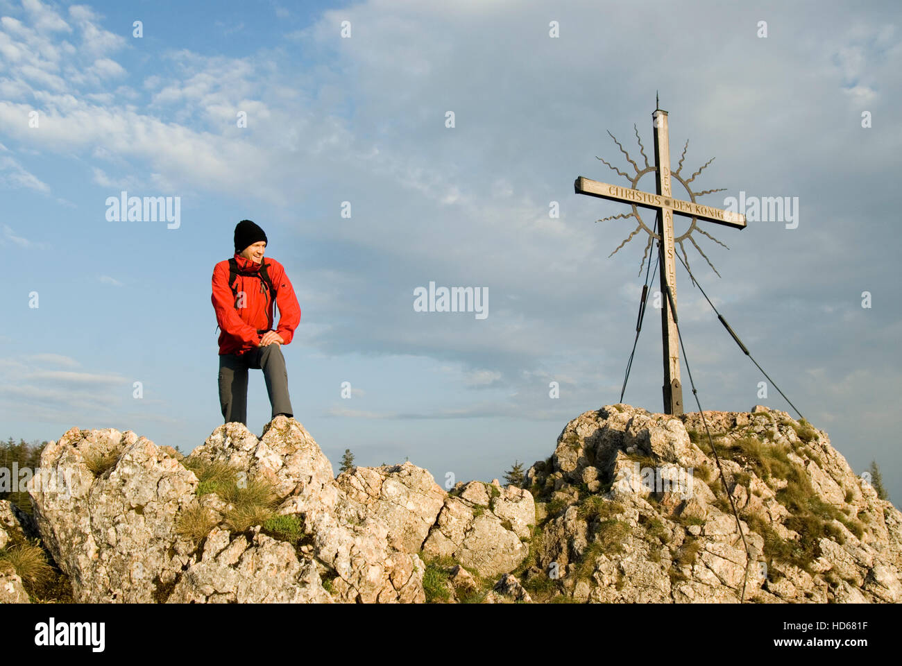 Man at a cross on the summit of a mountain, Reichraming, Upper Austria, Austria, Europe Stock Photo