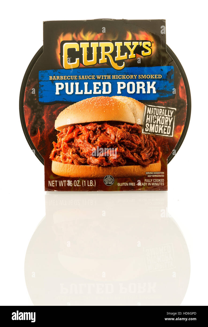 Winneconne, WI - 7 December 2016:  Container of Curly's pulled pork in hickory smoked flavor on an isolated background. Stock Photo