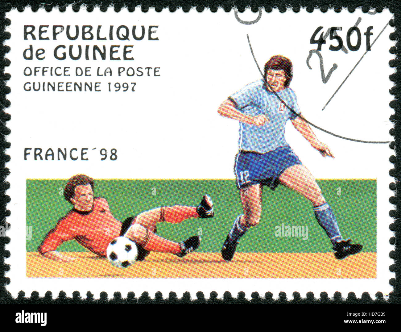 GUINEA - CIRCA 1997: A stamp printed in Guinea dedicated to the FIFA World Cup 1998 - France, shows the Game scene, circa 1997 Stock Photo