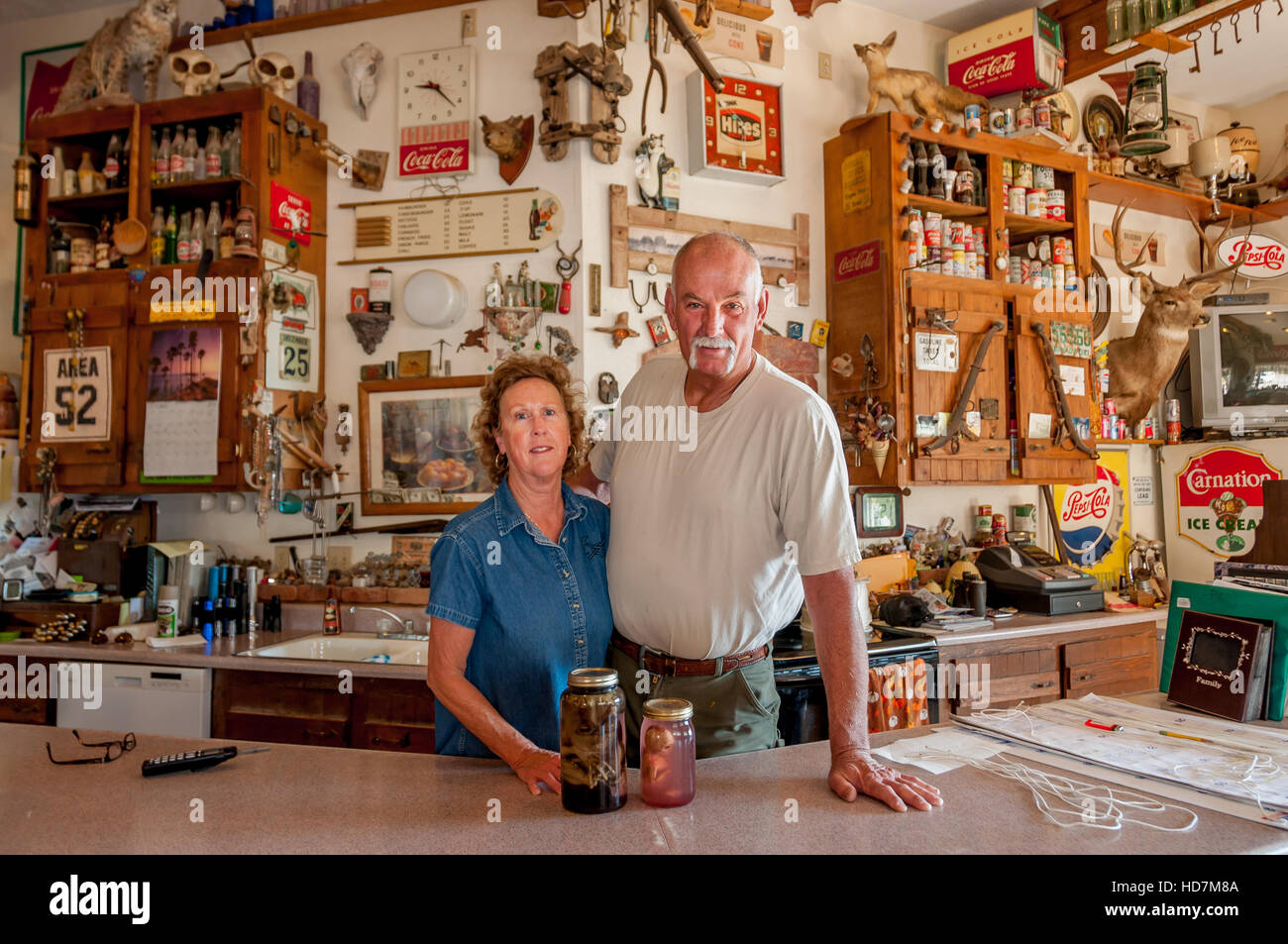 The Werlys, owners of Techatticup Mine in gift shop w/ memorabilia and movie props (alien babies), a fun stop on road trips in the American southwest. Stock Photo