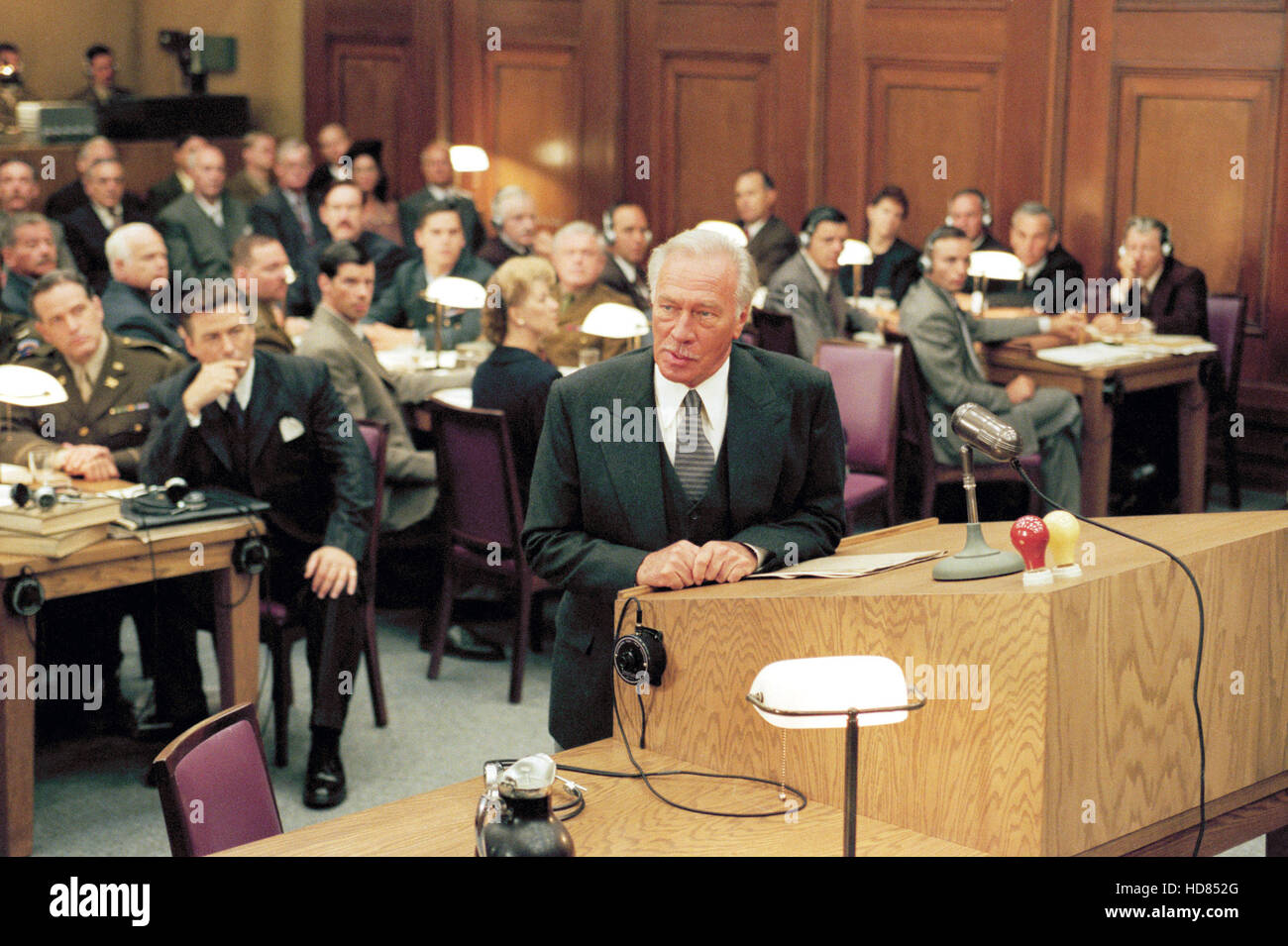 NUREMBERG, Alec Baldwin (left background), Christopher Plummer (center