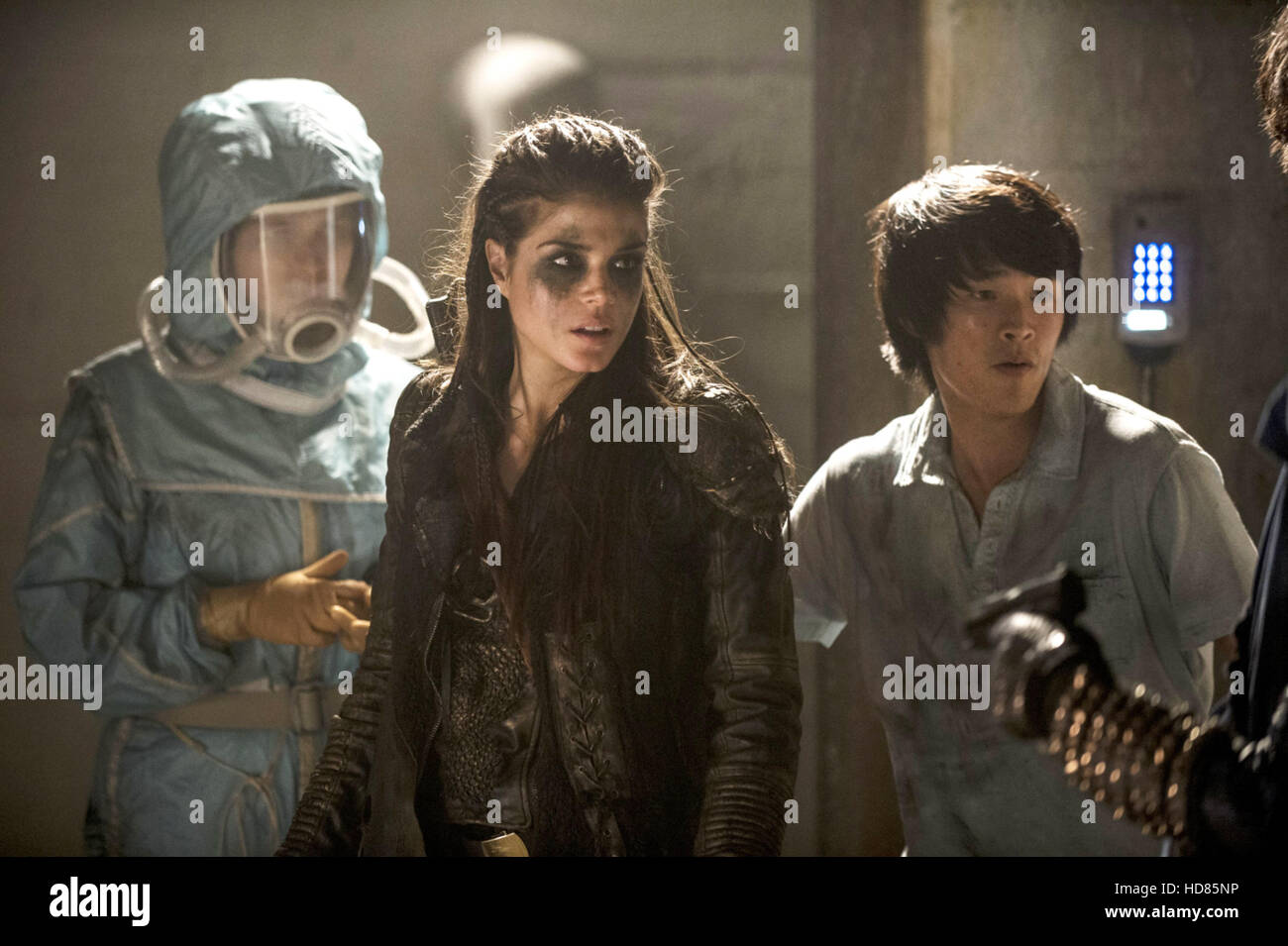 THE 100, (from left): Eve Harlow, Marie Avgeropoulos, Chris Larkin