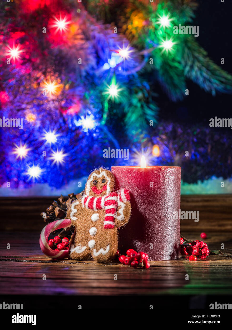 Gift boxes, candle lights and frozen window. Christmas background. Stock Photo