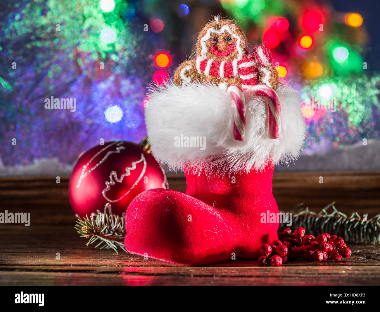 Christmas stocking, toy ginger man and candy canes. Christmas symbols. Stock Photo