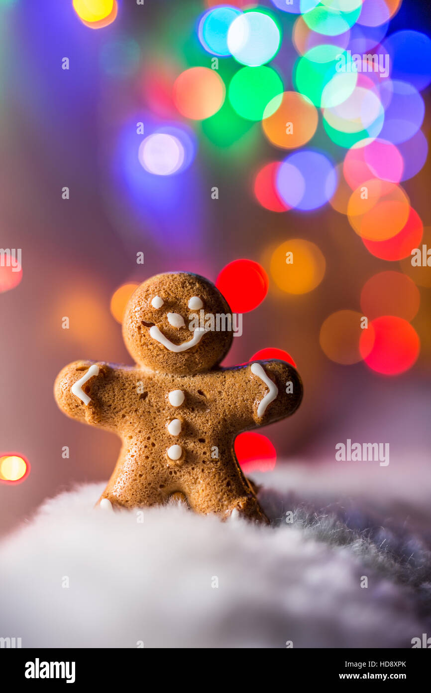 Gingerbread man in the snow. Christmas symbol. Stock Photo