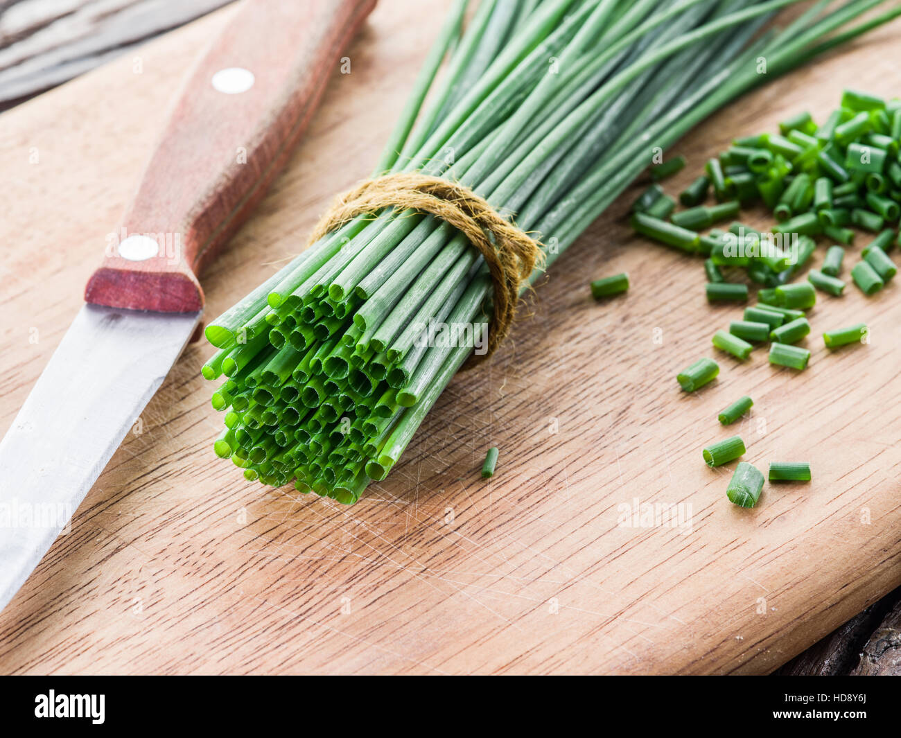 Green onion on the wooden table Stock Photo - Alamy