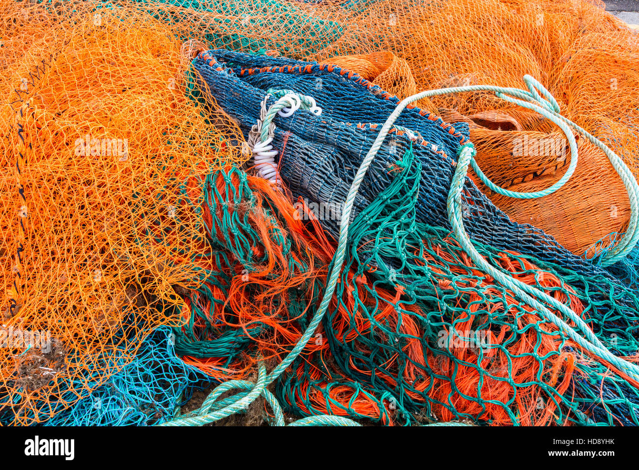 Fishing nets piled together at fishing village Stock Photo Alamy